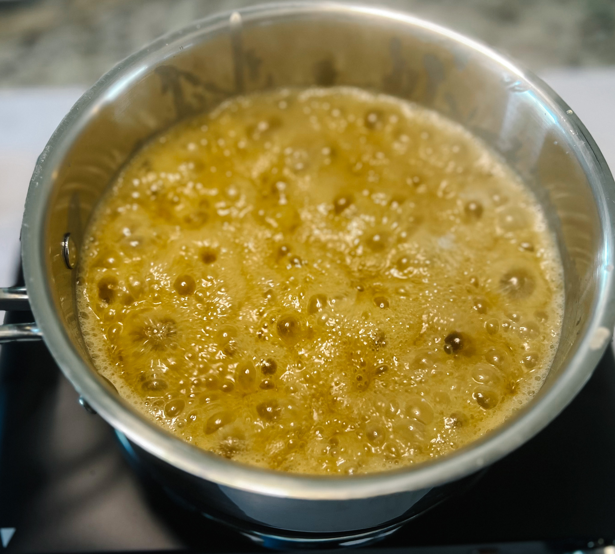caramel sauce boiling on the stove top