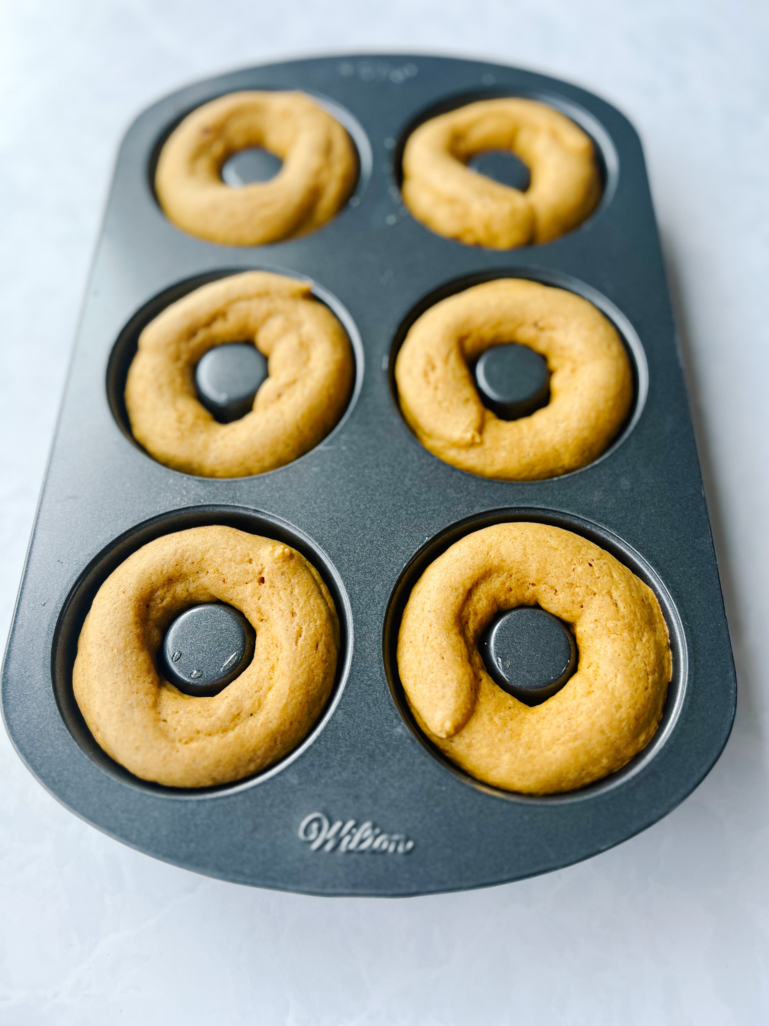 baked doughnuts in pan
