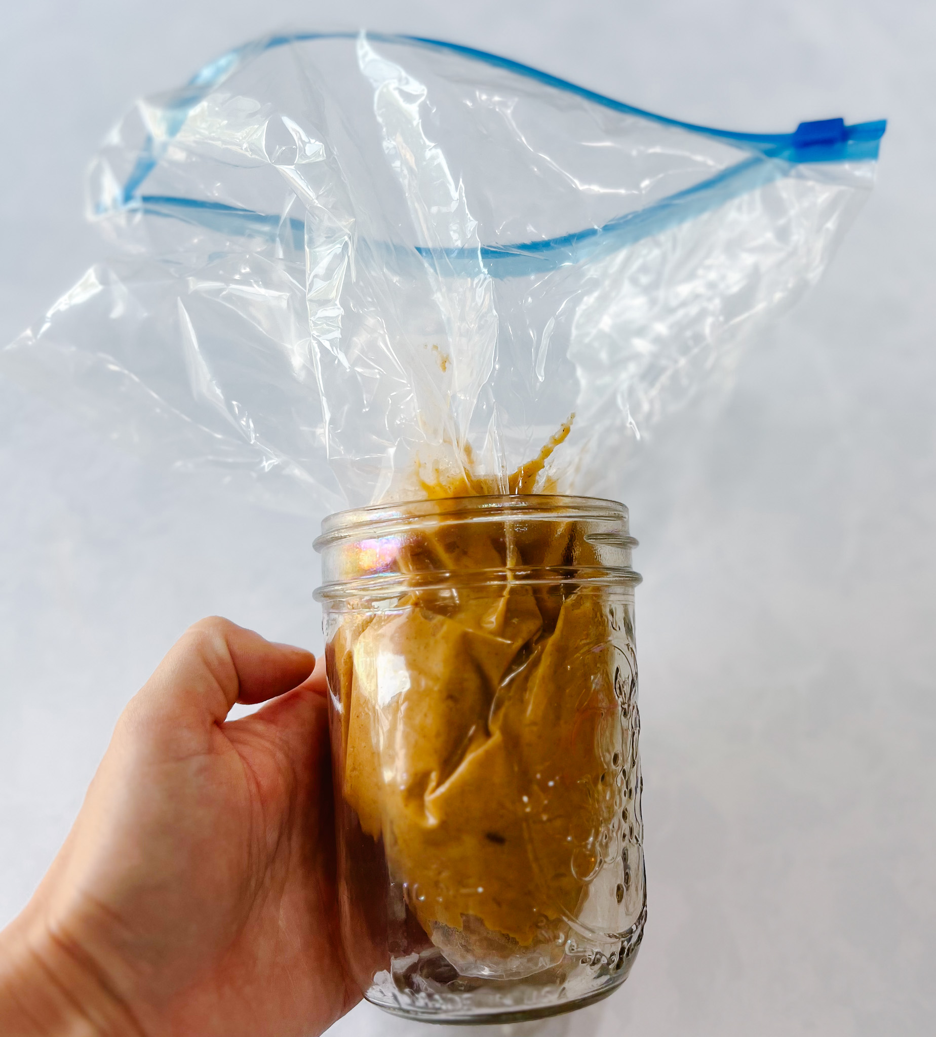 batter in plastic bag in glass