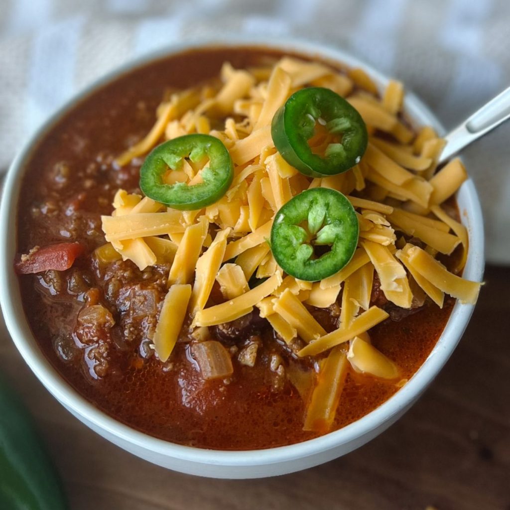 chili with shredded cheese and jalapeno