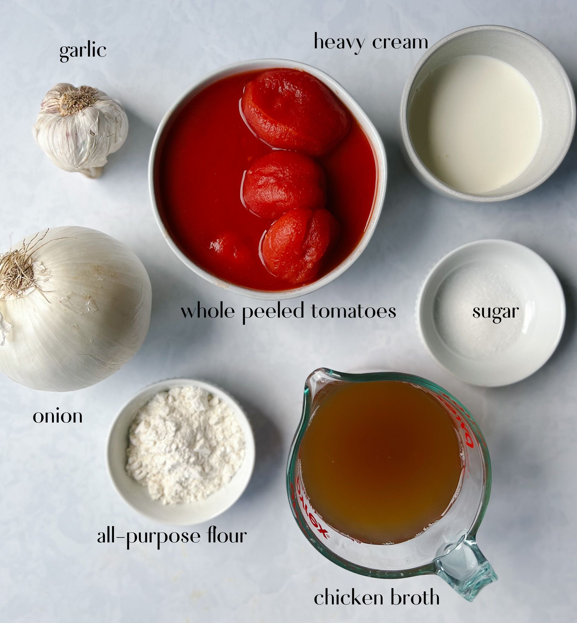 garlic, heavy cream, whole peeled tomatoes, sugar, onion, flour, and chicken broth.