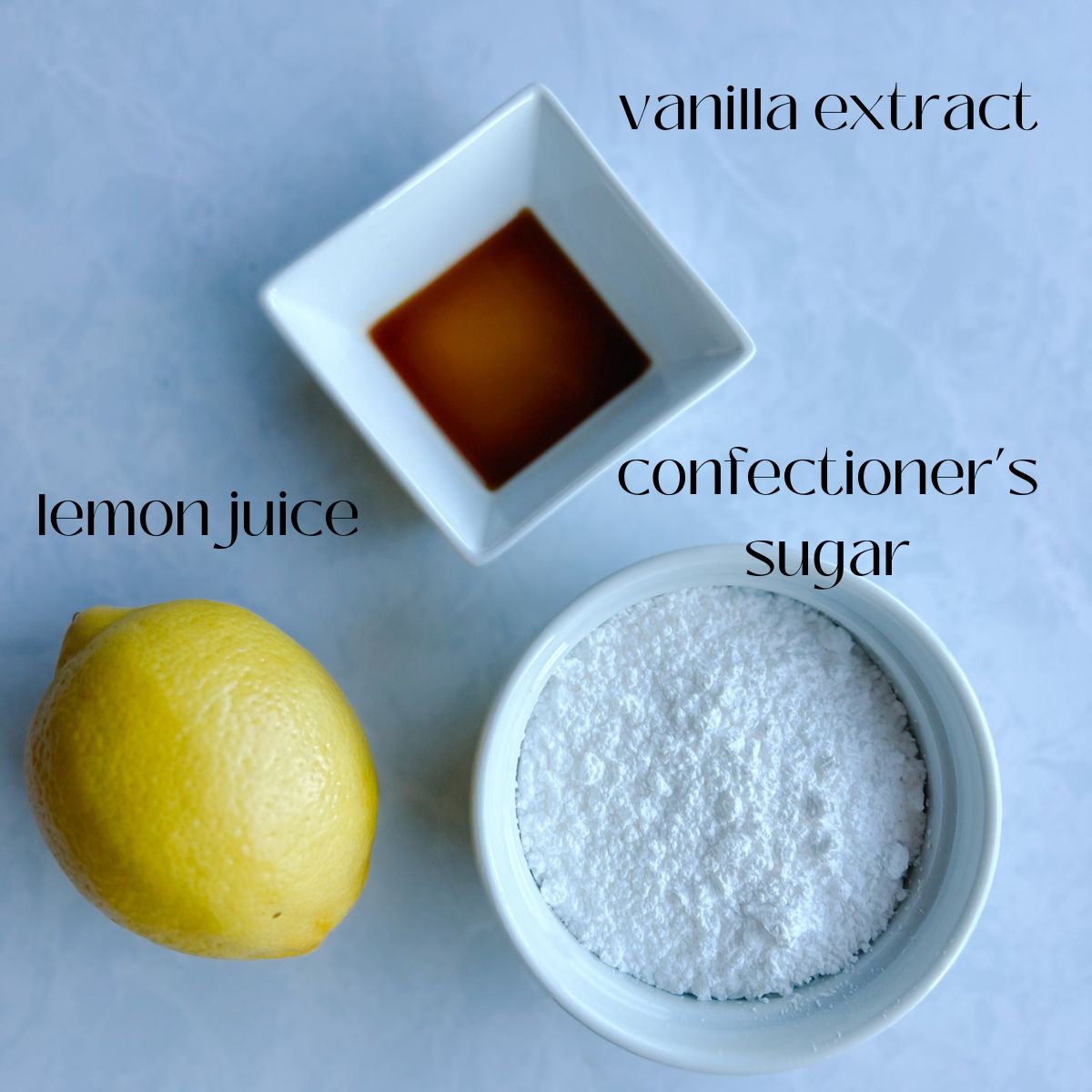 lemon glaze ingredient shot- vanilla extract, lemon juice, and confectioner's sugar.