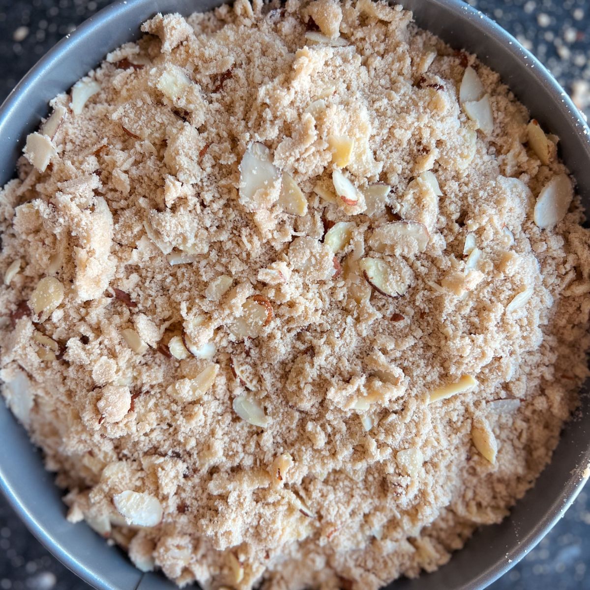 Unbaked almond coffee cake in the pan.