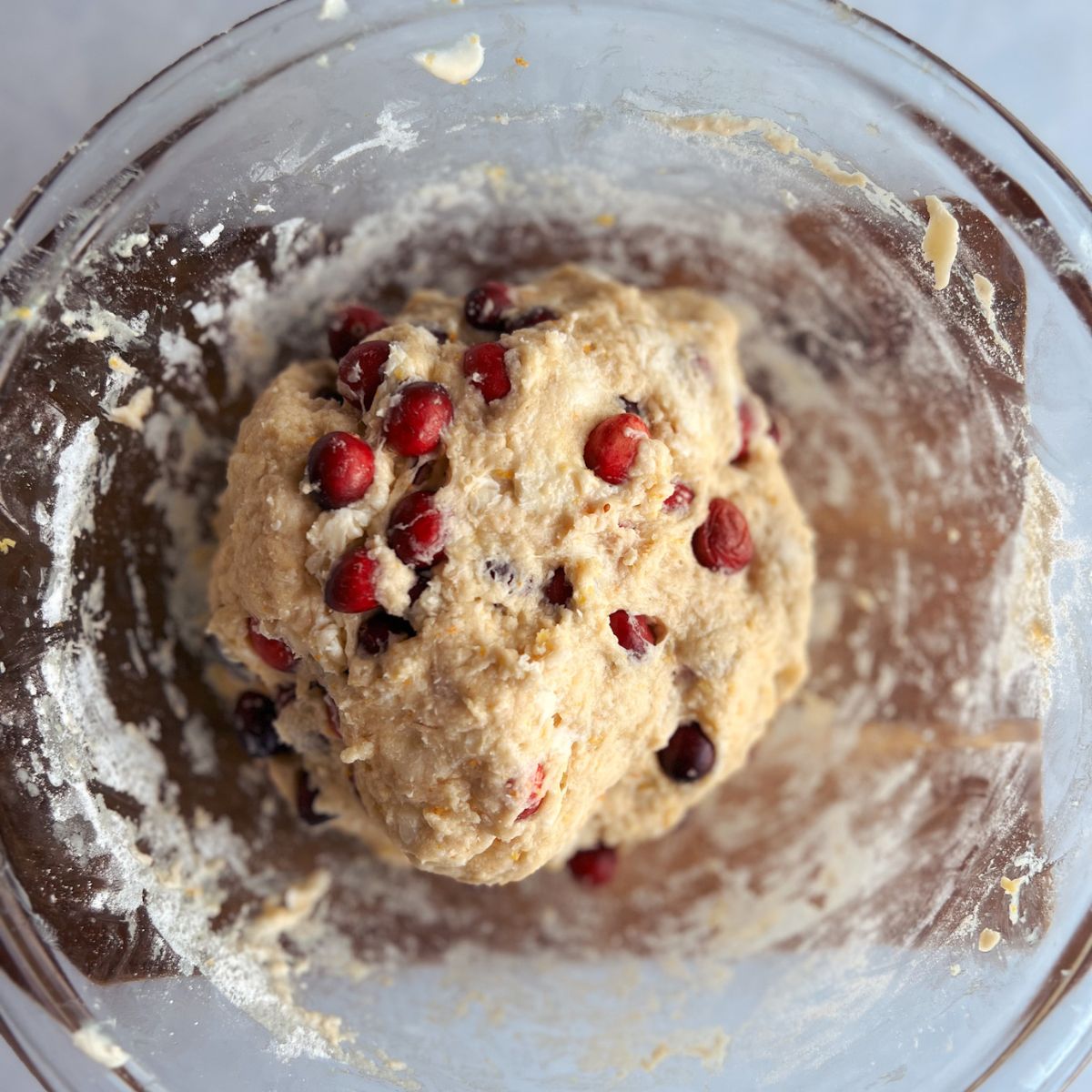 Ball of scone dough with cranberries.