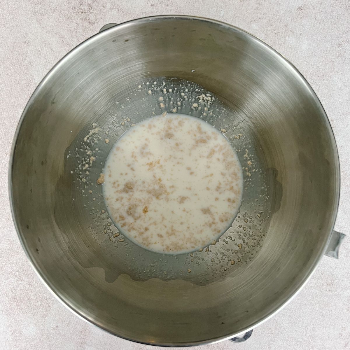 Step One: Yeast, sugar, warm milk in mixing bowl.