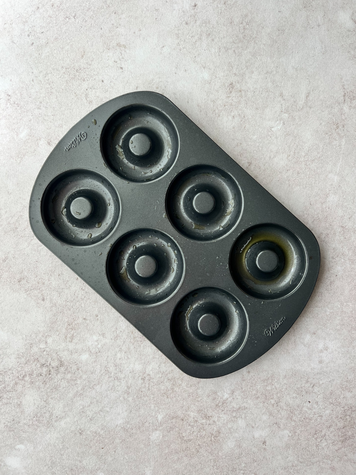 A greased donut pan.