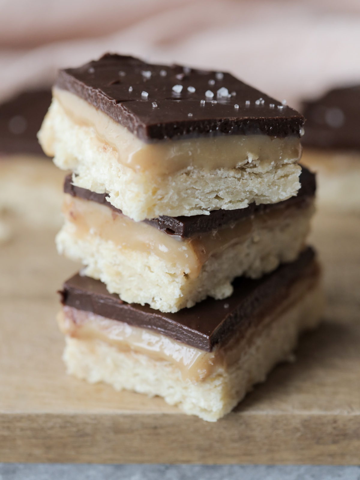Three sourdough millionaire's shortbread stacked.