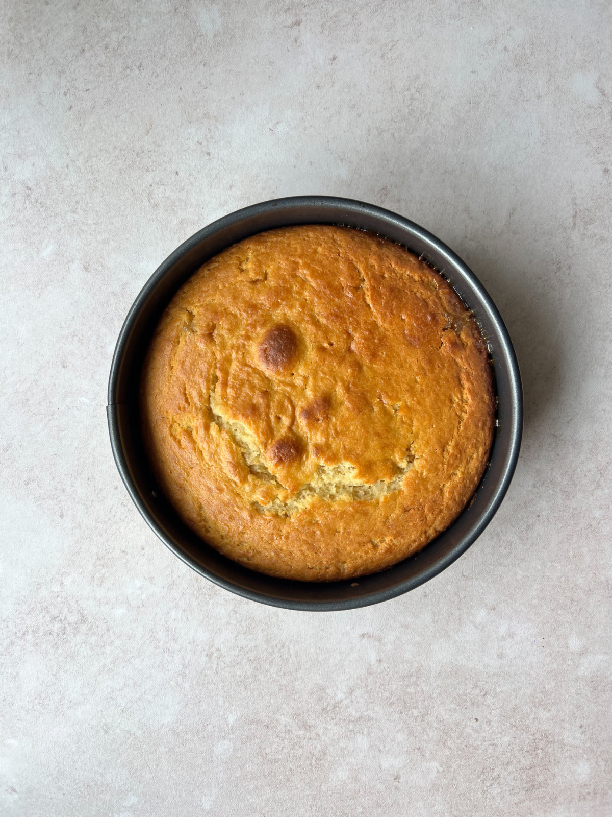 The cake in the pan after being baked.