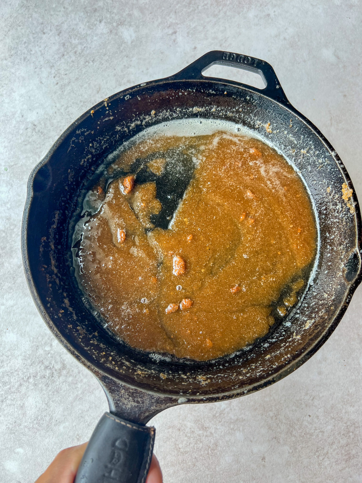 This is a cast iron skillet of brown sugar sauce.