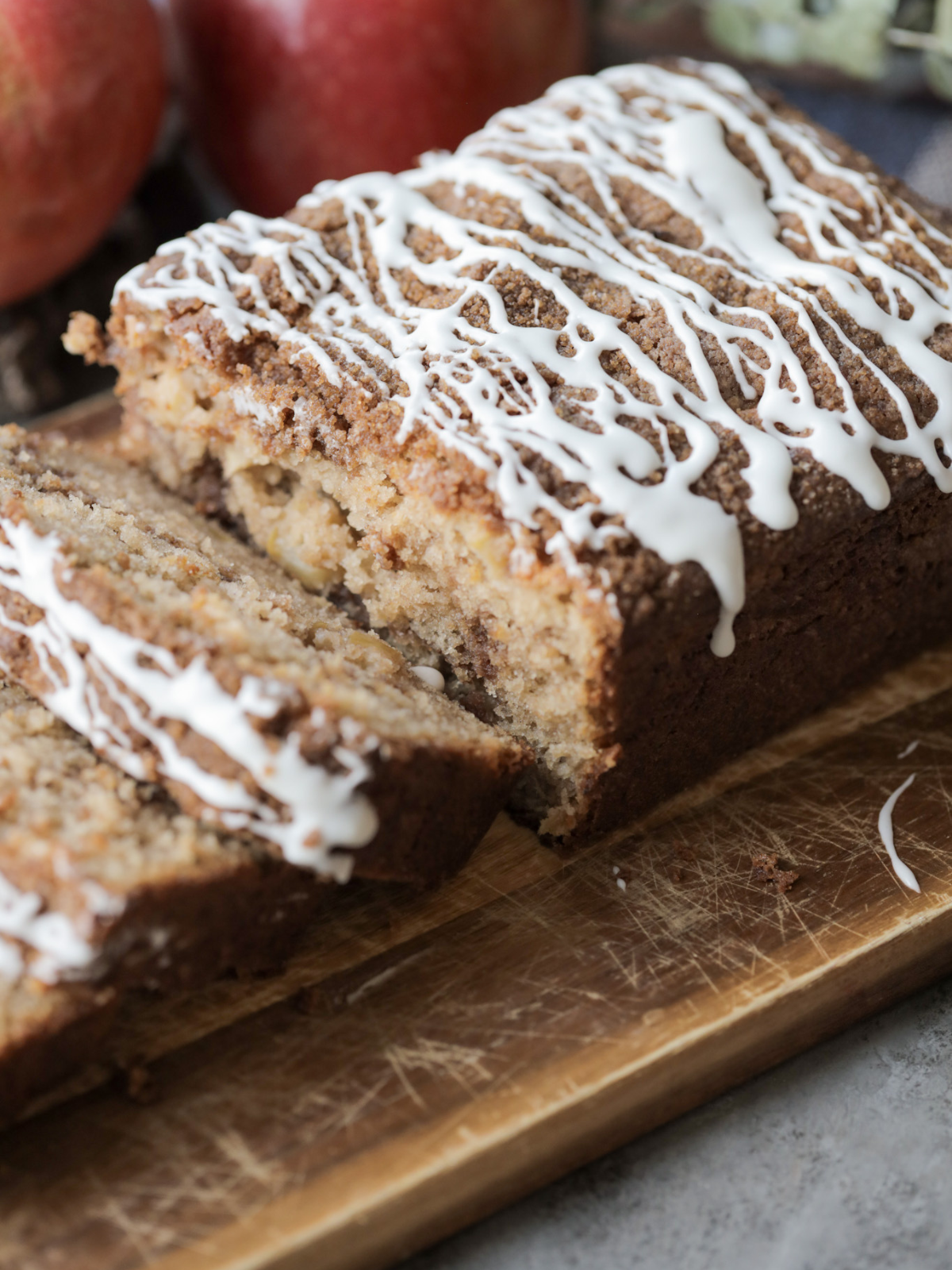Closeup of the brown butter apple streusel bread with a couple slices cut out.