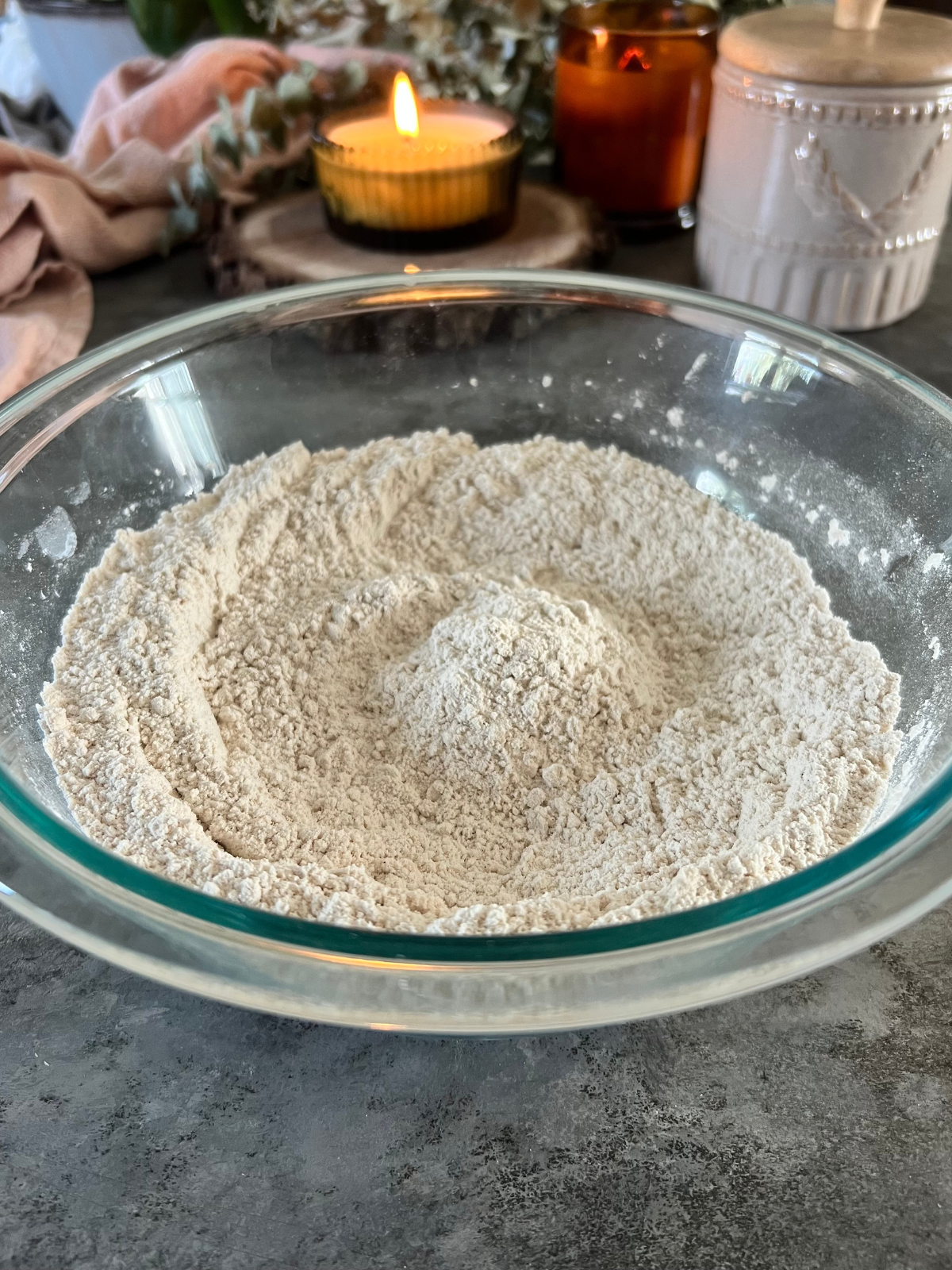 The dry ingredients for the sourdough discard oatmeal cream pies sit in a medium-sized mixing bowl.