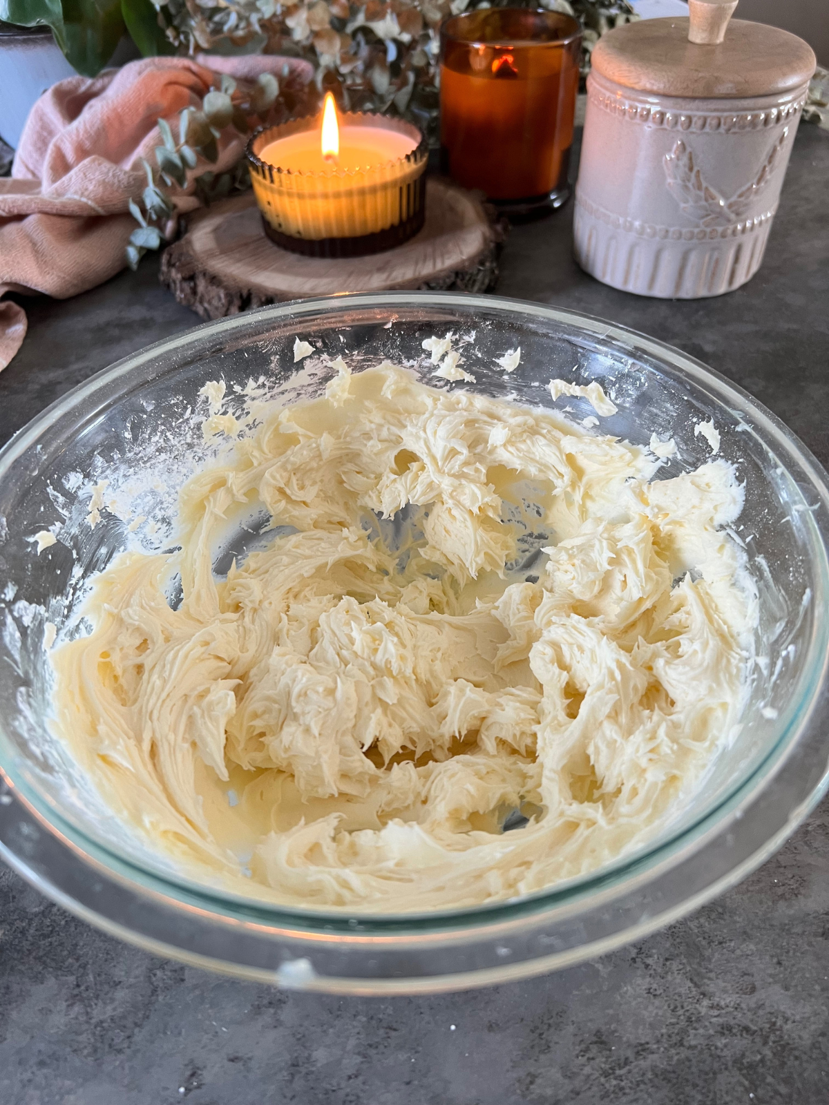 A glass mixing bowl has the vanilla cream filling for the sourdough oatmeal cream pies.