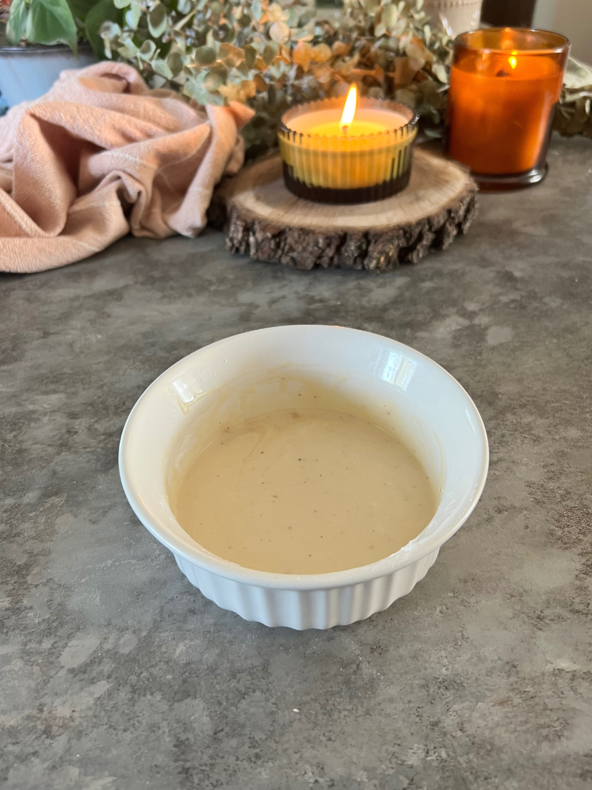 The vanilla bean icing sits in a small bowl.