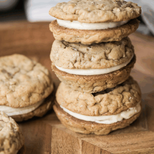 Three sourdough oatmeal cream pies stacked on top of each other.