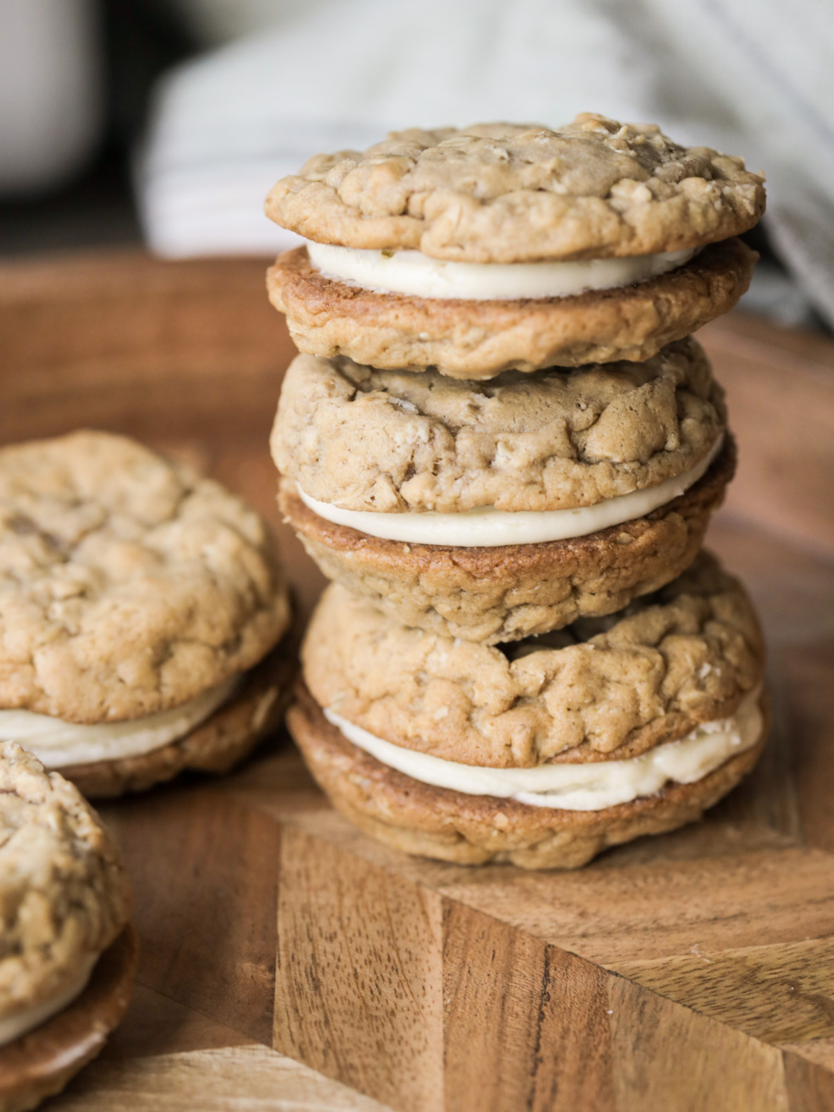 Three sourdough oatmeal cream pies stacked on top of each other.
