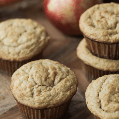 From-scratch long-fermented sourdough apple and carrot muffins on a tray.