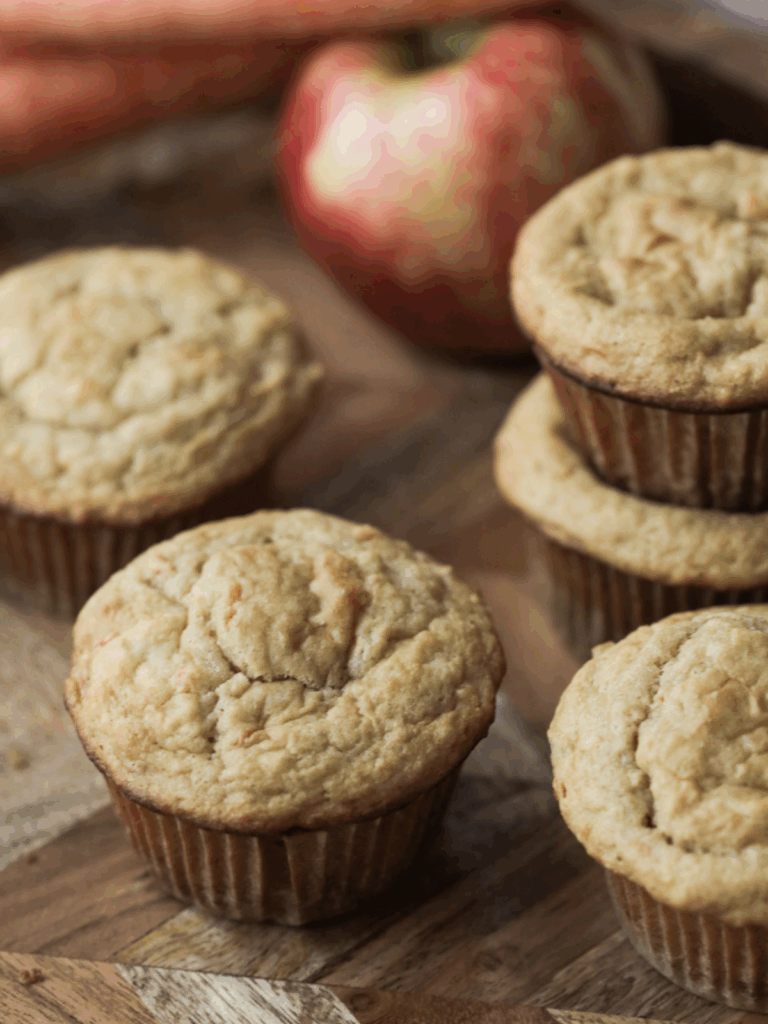 From-scratch long-fermented sourdough apple and carrot muffins on a tray.