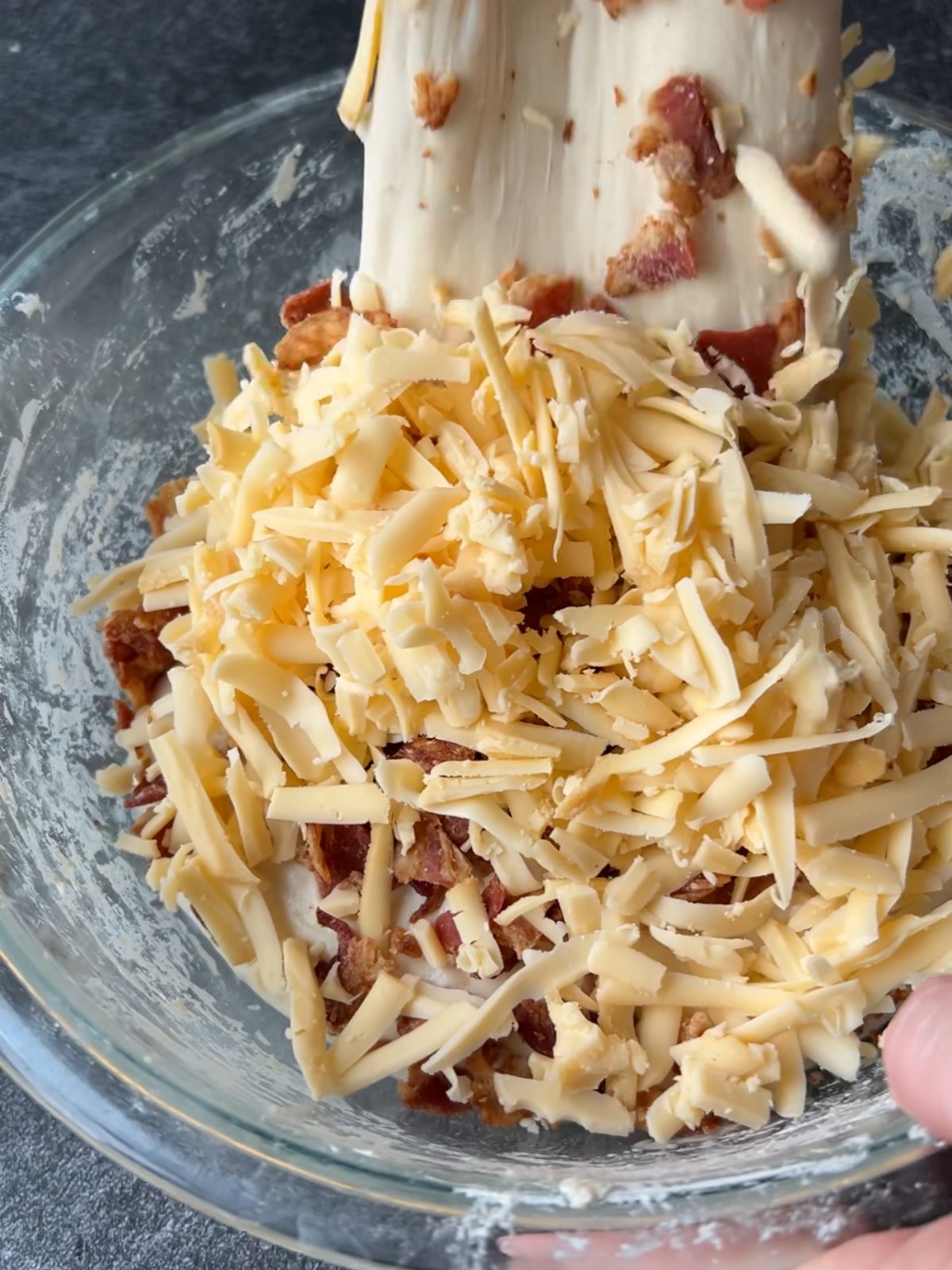 I'm starting to fold the dough over the inclusions during the second set of stretch and folds.