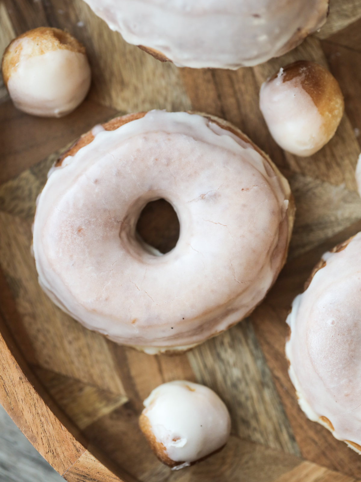 Soft and fluffy sourdough glazed donuts and glazed donuts holes with vanilla bean glaze.
