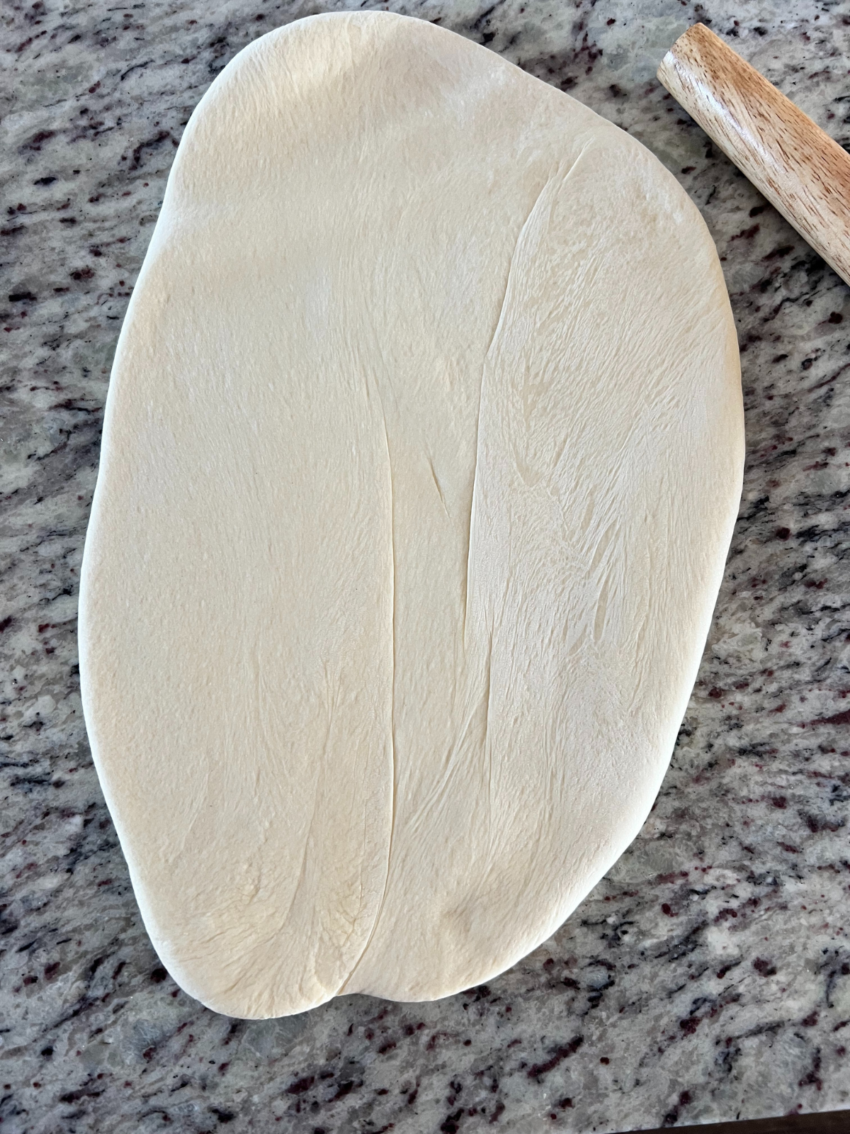 The dough has been rolled out to shape the donuts.