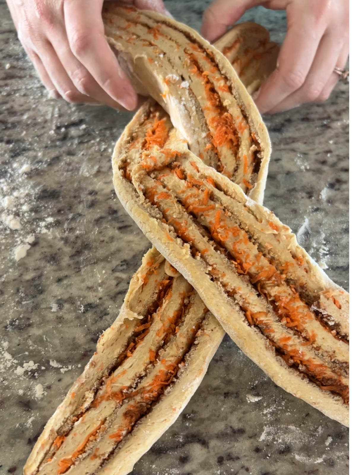 The second step of braiding the sourdough carrot cake babka is shown here.