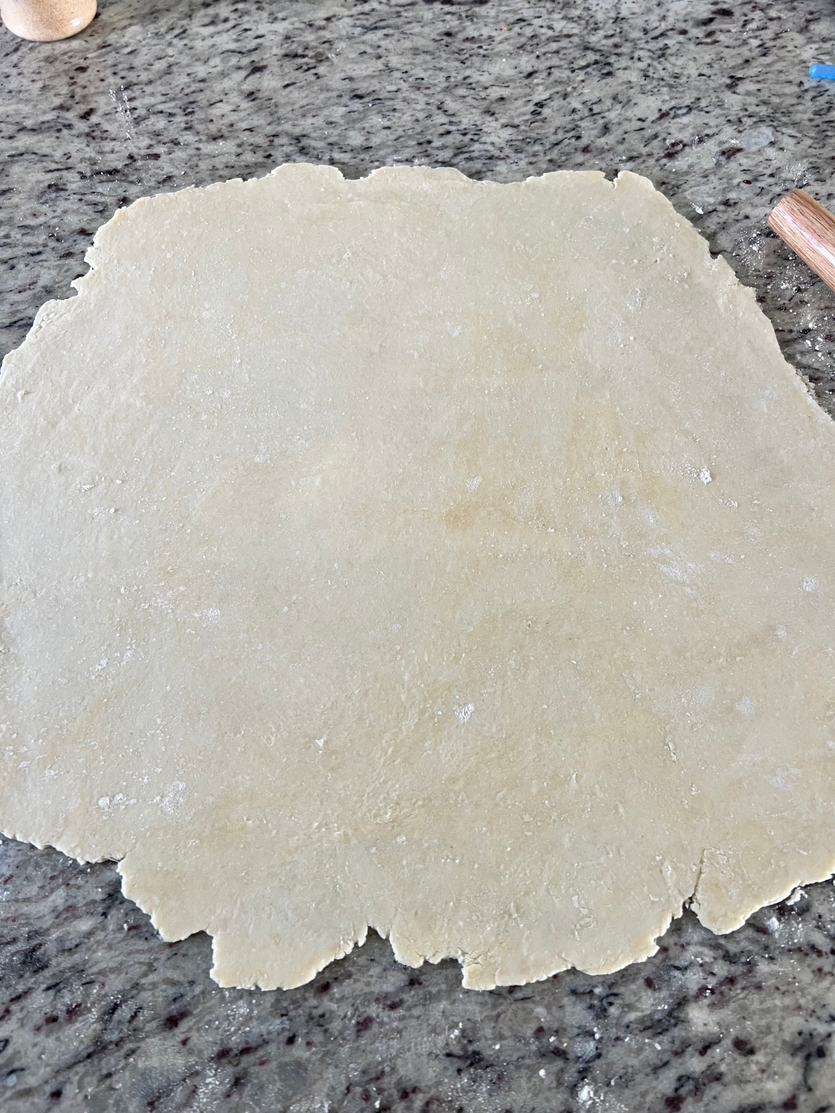 The sourdough discard hand pie crust is shown rolled out.