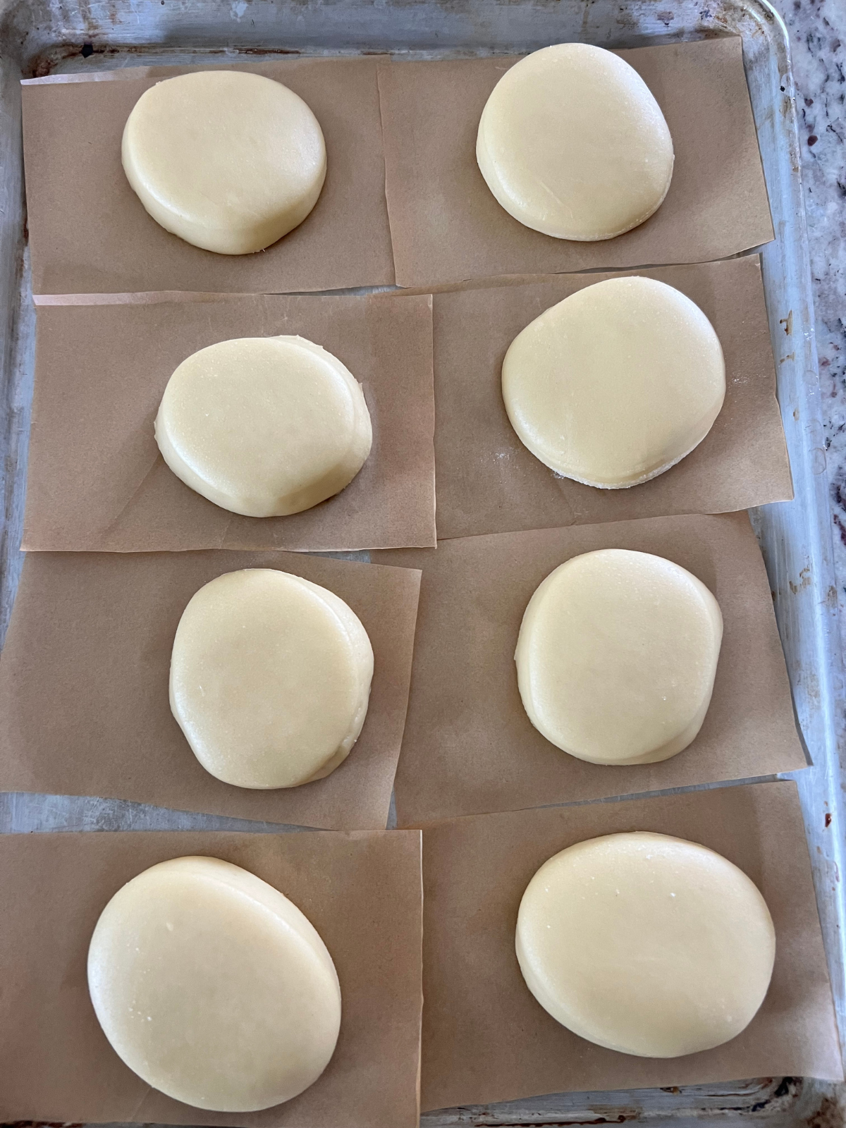 The sourdough brioche donuts have risen and are ready to be fried.