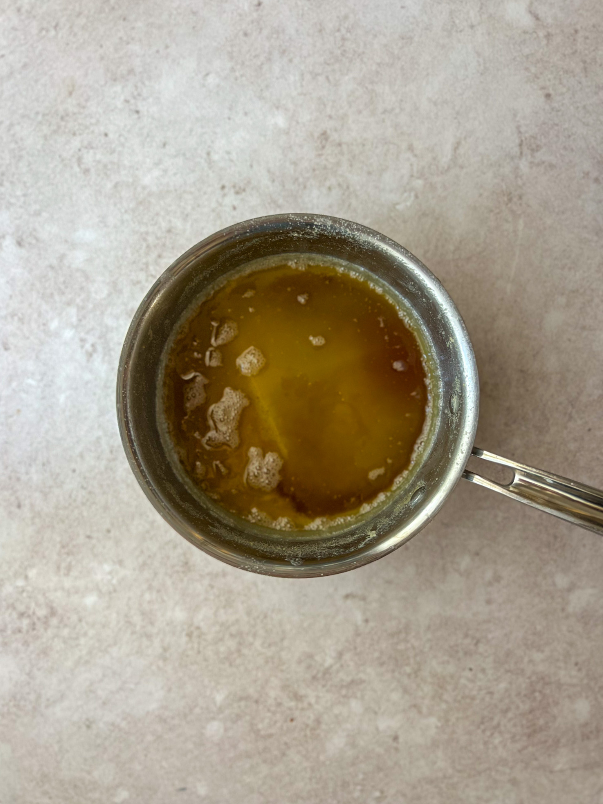 Browned butter is shown in a medium saucepan.