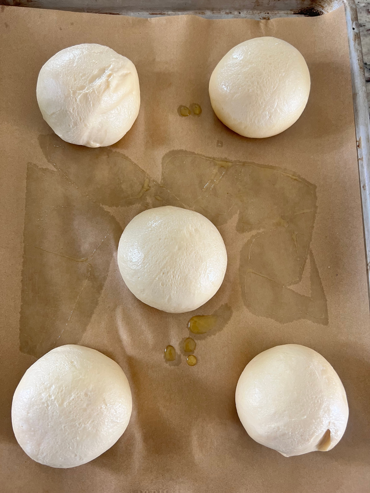 The sourdough lemon curd cream cheese dough balls have risen and are ready to be shaped and filled.