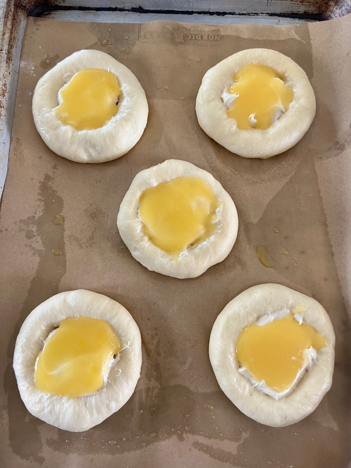 The sourdough buns have been filled with a sweet cream cheese filling and lemon curd.