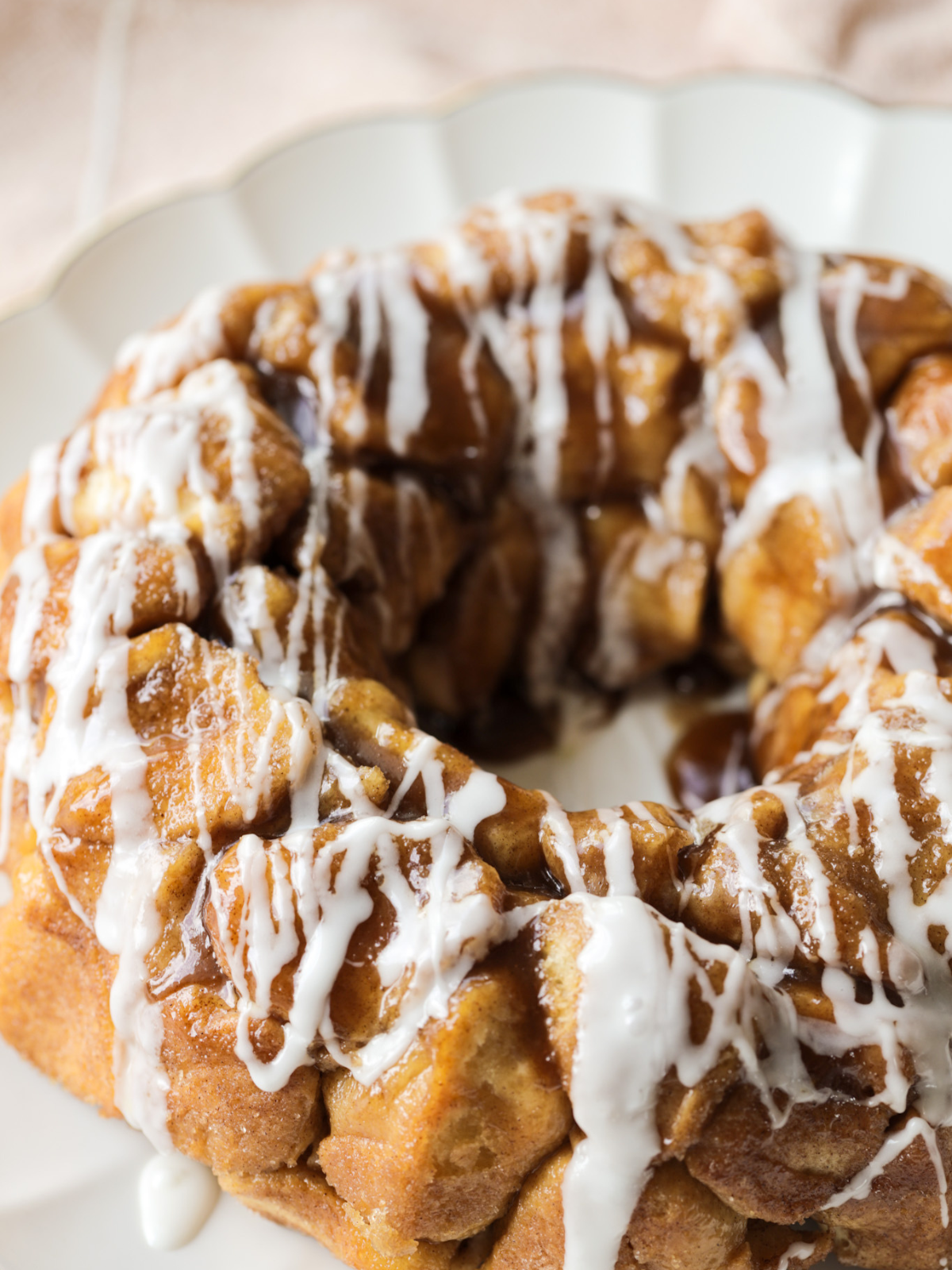 A side profile of the sourdough monkey bread with vanilla icing.