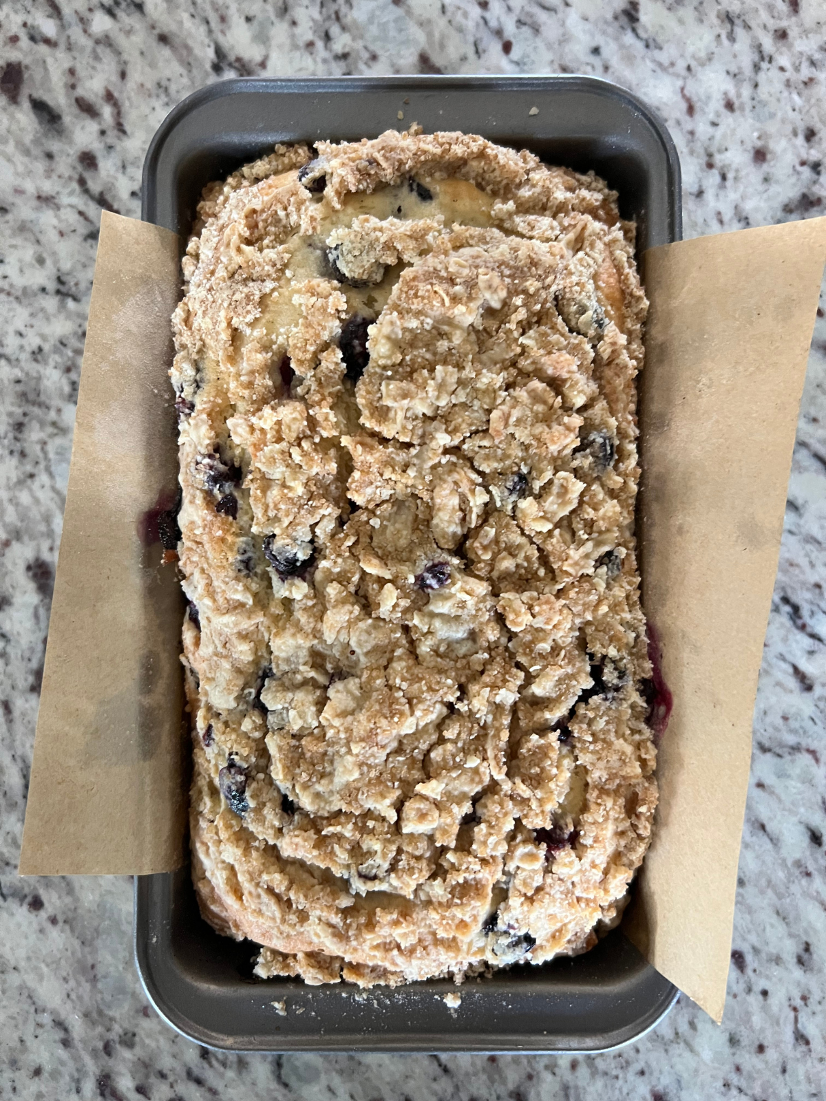 The sourdough discard crumble loaf is baked and fresh out of the oven. It will cool and be iced next.