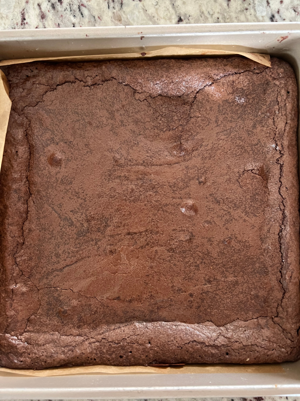 The brownies are shown in the pan fresh out of the oven.