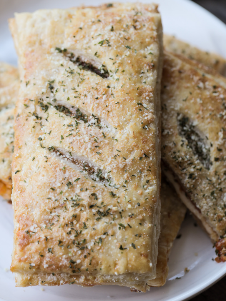 A closeup of a sourdough discard pepperoni pizza hot pocket fresh out of the oven.