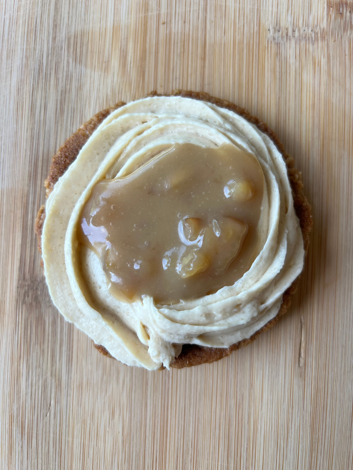 The sourdough brown butter cookie has been topped with the brown sugar frosting and caramel apple filling.