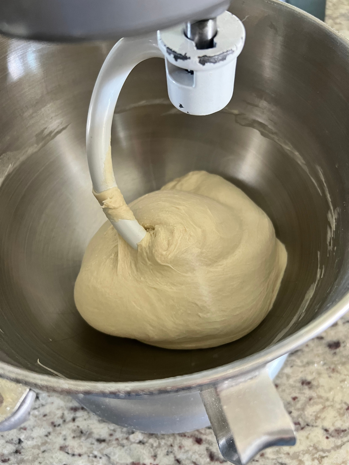 The sourdough English muffin dough has been kneaded for 8 minutes and is no longer sticking to the sides. It's ready to bulk ferment.