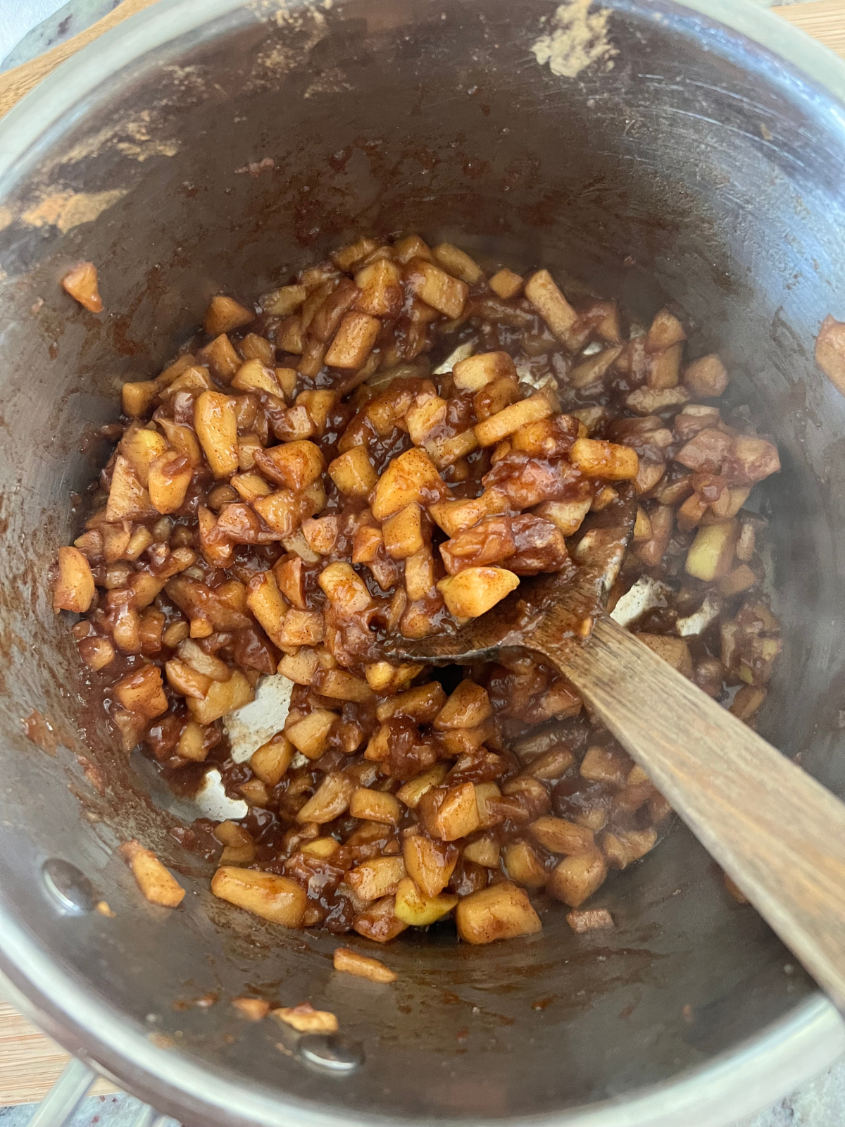 The fully cooked apple filling is shown in the saucepan.