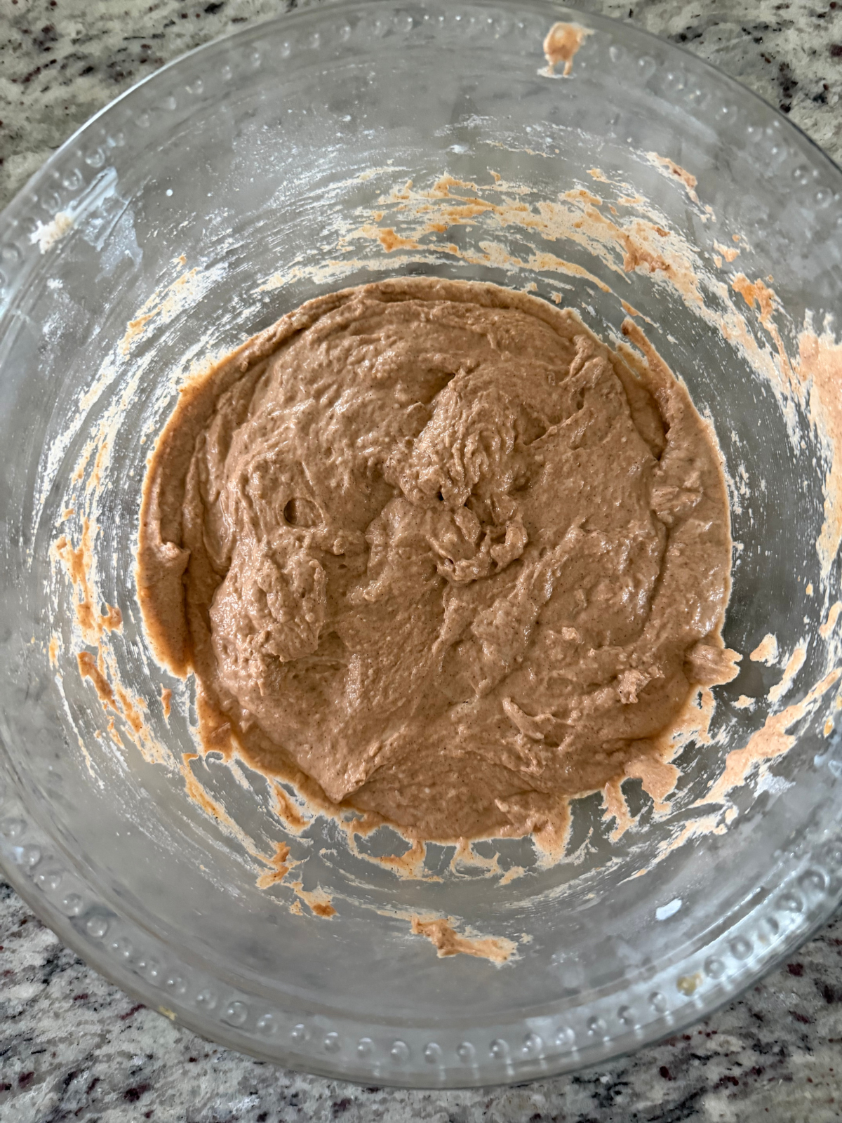 The fermented sourdough pumpkin pancake batter sits in the bowl after an overnight ferment.
