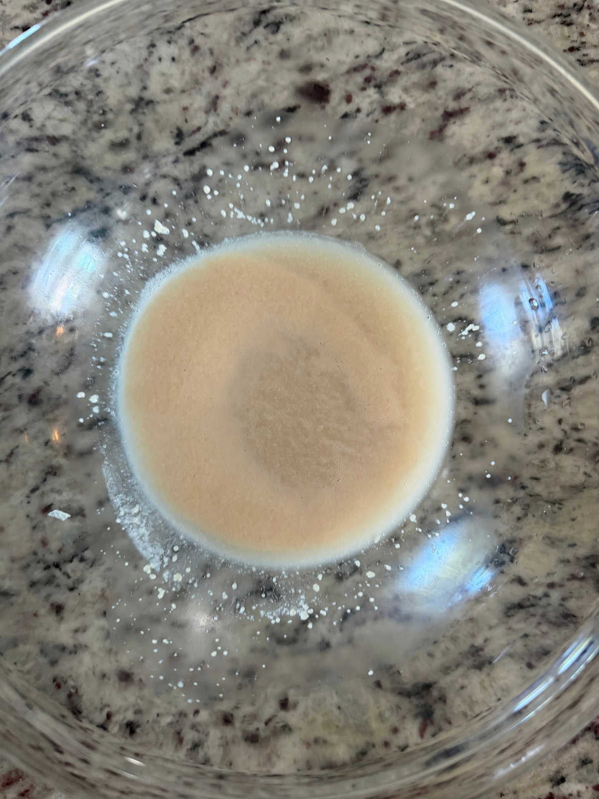 The yeast, sugar, and water is foamy and active--ready to make the dough!