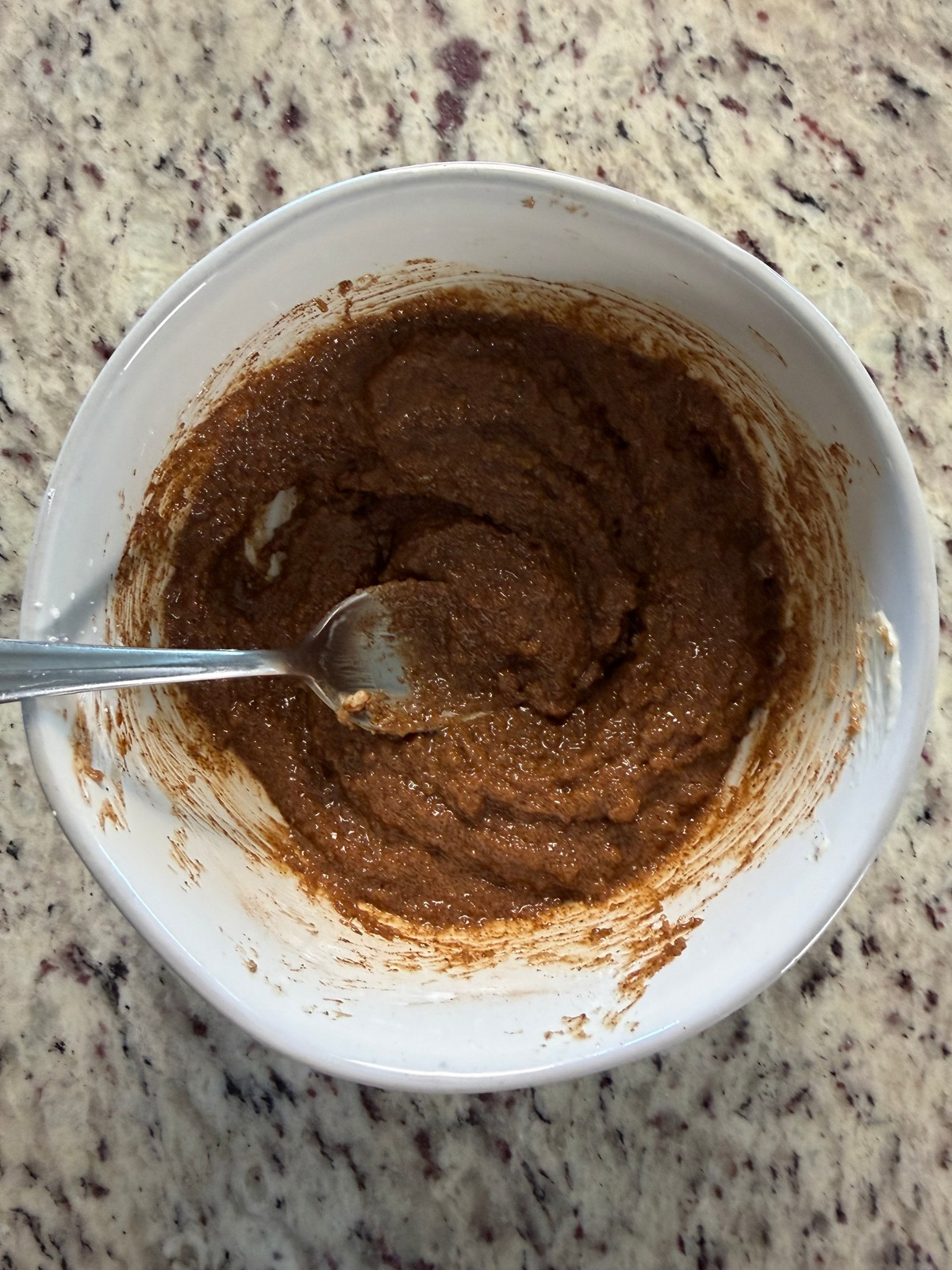 The cinnamon sugar filling is shown in a bowl with a spoon. 