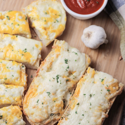 A closeup of the sliced sourdough cheesy garlic bread is shown.